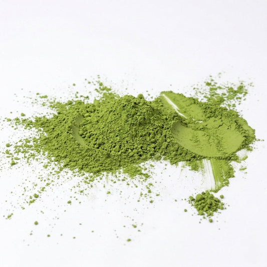 Green powder on a white background